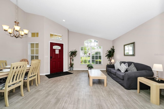 1520 Gulf Vue Dr, Haines City, FL 33844 - living room featuring a chandelier, high vaulted ceiling, and light wood-style flooring