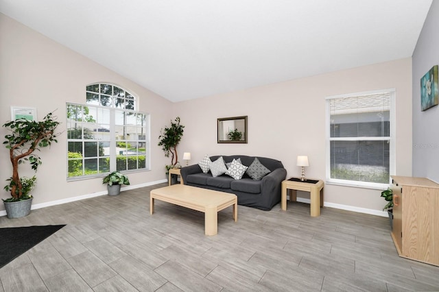 1520 Gulf Vue Dr, Haines City, FL 33844 - living area with light wood-type flooring and vaulted ceiling