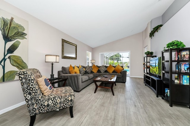1520 Gulf Vue Dr, Haines City, FL 33844 - living area featuring light wood finished floors and lofted ceiling