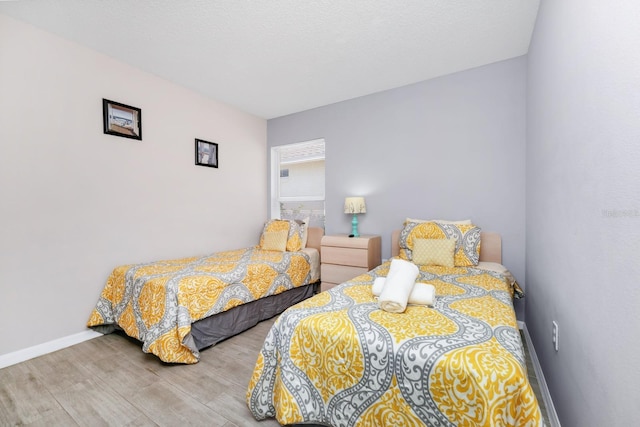 1520 Gulf Vue Dr, Haines City, FL 33844 - bedroom with wood finished floors and baseboards