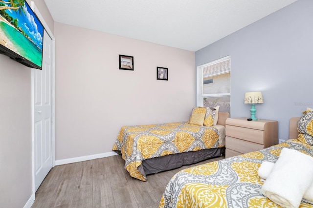 1520 Gulf Vue Dr, Haines City, FL 33844 - bedroom featuring wood finished floors and baseboards