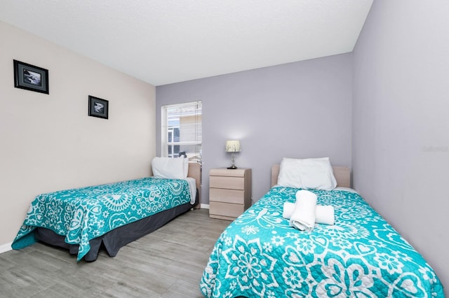 1520 Gulf Vue Dr, Haines City, FL 33844 - bedroom featuring wood finished floors and baseboards