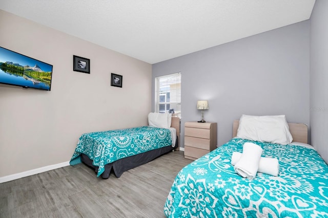 1520 Gulf Vue Dr, Haines City, FL 33844 - bedroom featuring wood finished floors and baseboards