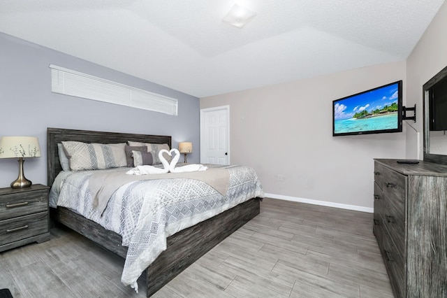 1520 Gulf Vue Dr, Haines City, FL 33844 - bedroom with baseboards and wood tiled floors