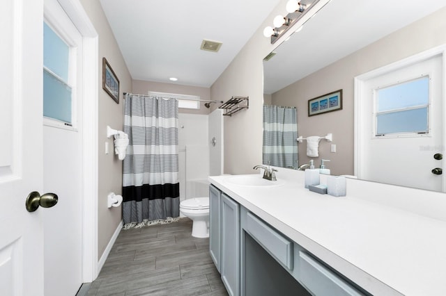 1520 Gulf Vue Dr, Haines City, FL 33844 - full bath with vanity, a shower with shower curtain, and wood finished floors