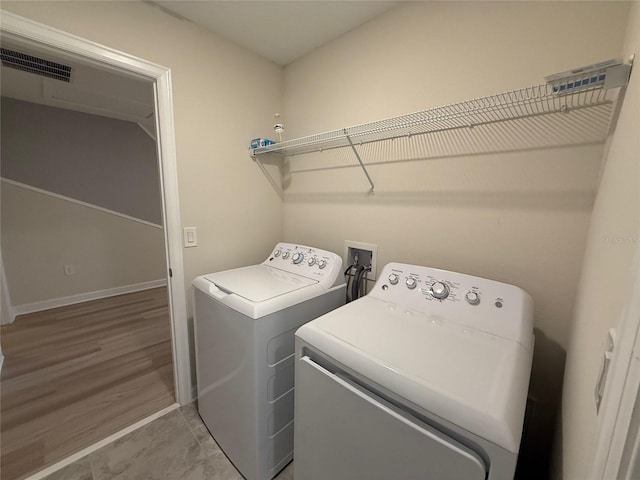 18219 Oliver Twist Way, Winter Garden, FL 34787 - laundry area with washing machine and dryer and baseboards