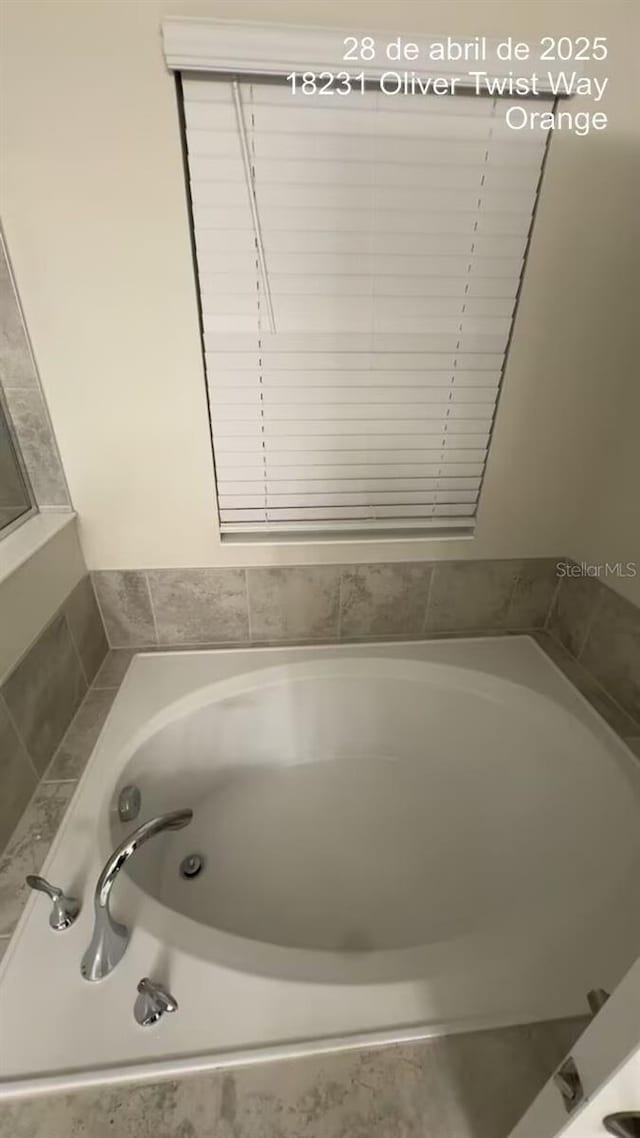 18219 Oliver Twist Way, Winter Garden, FL 34787 - full bath featuring a garden tub