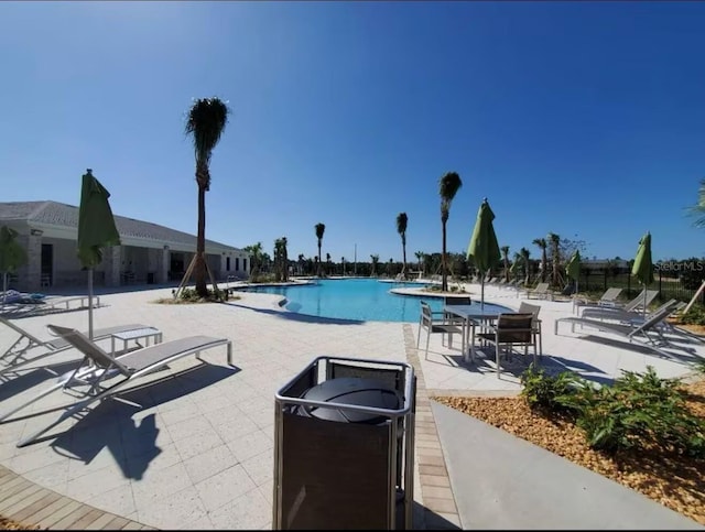 18219 Oliver Twist Way, Winter Garden, FL 34787 - community pool with a patio area