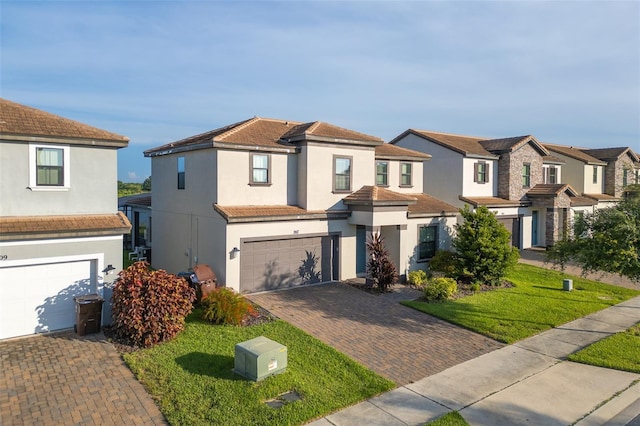 207 Macaulays Cv, Haines City, FL 33844 - view of front of property with stucco siding, a garage, decorative driveway, and a residential view