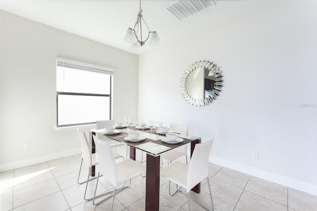 207 Macaulays Cv, Haines City, FL 33844 - dining room with a chandelier and light tile patterned flooring