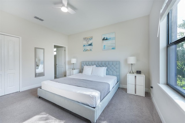 207 Macaulays Cv, Haines City, FL 33844 - carpeted bedroom with multiple windows, ceiling fan, and a closet