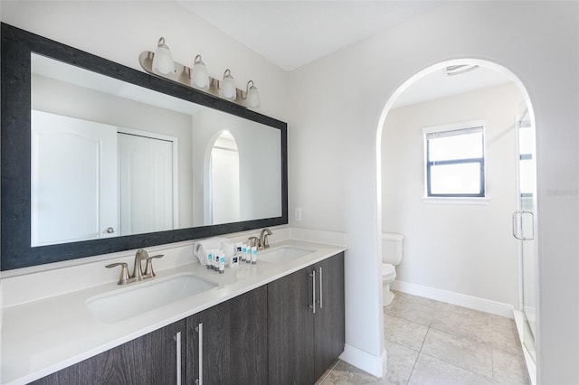 207 Macaulays Cv, Haines City, FL 33844 - full bath featuring double vanity, a shower stall, and tile patterned flooring