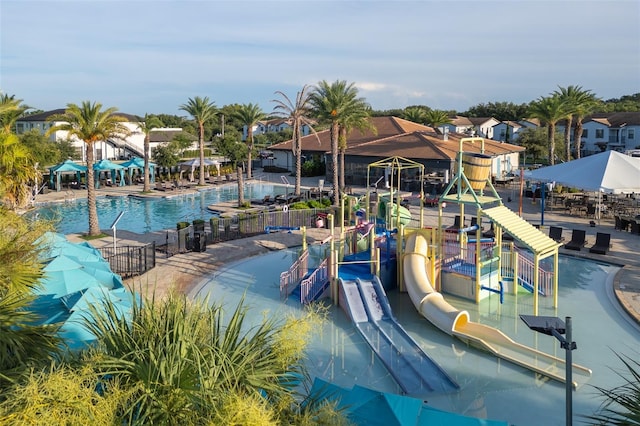 207 Macaulays Cv, Haines City, FL 33844 - community pool featuring a water slide and a water play area