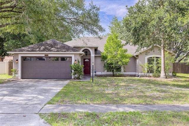 3245 Kings Ridge Ter, Deltona, FL 32725 - ranch-style house featuring stucco siding, driveway, an attached garage, and a shingled roof