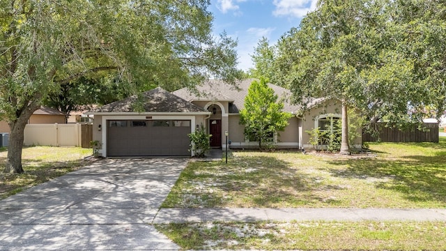 3245 Kings Ridge Ter, Deltona, FL 32725 - ranch-style home featuring stucco siding, an attached garage, and concrete driveway