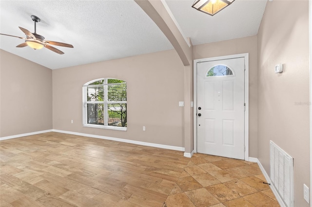 3245 Kings Ridge Ter, Deltona, FL 32725 - foyer with arched walkways and a ceiling fan
