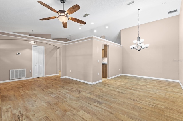 3245 Kings Ridge Ter, Deltona, FL 32725 - unfurnished room with vaulted ceiling, a ceiling fan, light wood-style flooring, and a chandelier