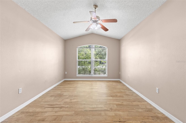 3245 Kings Ridge Ter, Deltona, FL 32725 - spare room with light wood finished floors, lofted ceiling, a textured ceiling, and a ceiling fan