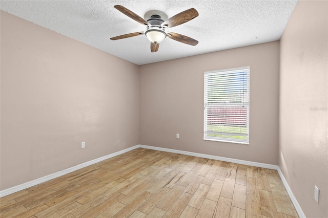 3245 Kings Ridge Ter, Deltona, FL 32725 - unfurnished room with light wood-style flooring, ceiling fan, and a textured ceiling