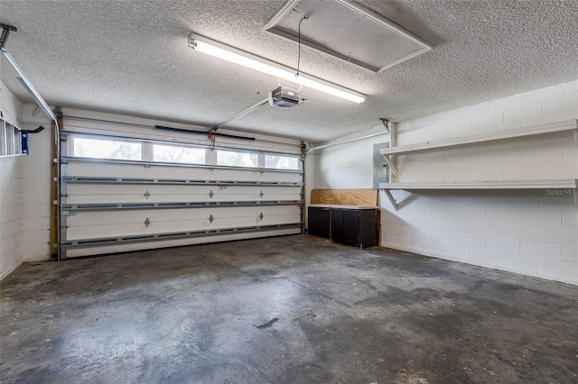 3245 Kings Ridge Ter, Deltona, FL 32725 - garage with a garage door opener and concrete block wall