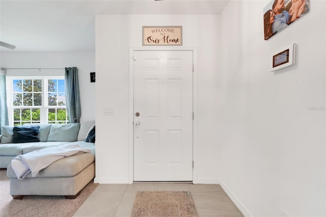 9370 Westmorely St, Groveland, FL 34736 - entryway featuring baseboards