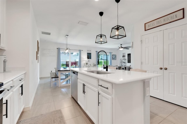9370 Westmorely St, Groveland, FL 34736 - kitchen with ceiling fan, stainless steel dishwasher, hanging light fixtures, and light countertops