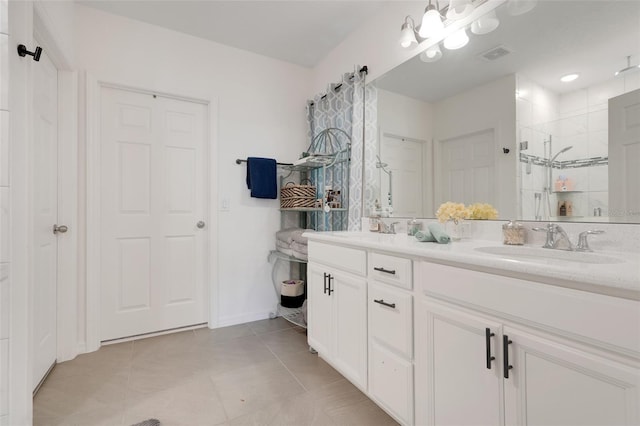 9370 Westmorely St, Groveland, FL 34736 - full bathroom with double vanity, tiled shower, and tile patterned floors