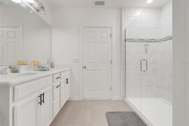 9370 Westmorely St, Groveland, FL 34736 - full bath with a shower stall, double vanity, and tile patterned flooring