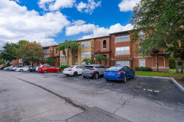 5140 Conroy Rd Unit 16, Orlando, FL 32811 - view of apartment building / complex featuring uncovered parking