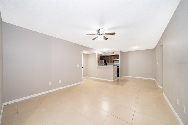 5140 Conroy Rd Unit 16, Orlando, FL 32811 - unfurnished living room featuring a ceiling fan and light tile patterned floors