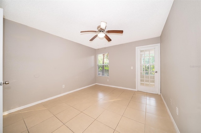 5140 Conroy Rd Unit 16, Orlando, FL 32811 - empty room featuring light tile patterned floors and a ceiling fan
