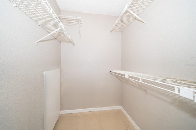 5140 Conroy Rd Unit 16, Orlando, FL 32811 - walk in closet featuring tile patterned floors