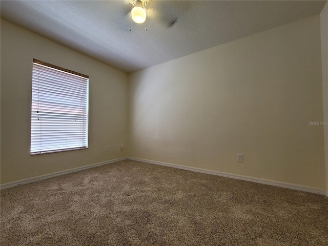 1914 Commander Way, Kissimmee, FL 34746 - unfurnished room with carpet flooring, a ceiling fan, and a textured ceiling