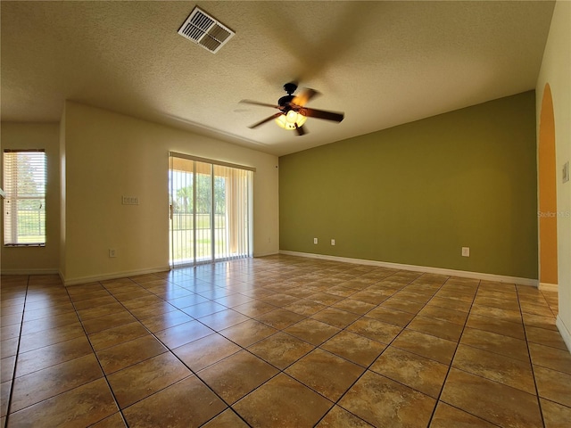 1914 Commander Way, Kissimmee, FL 34746 - unfurnished room featuring a ceiling fan, tile patterned floors, and a textured ceiling
