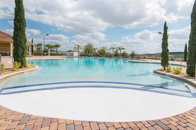 3685 Corsica Ln, Clermont, FL 34711 - community pool featuring a jacuzzi and a patio area