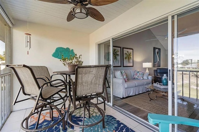 431 Cerromar Ln Unit 446, Venice, FL 34293 - balcony with a ceiling fan and an outdoor hangout area