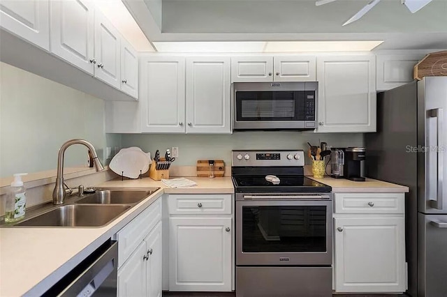 431 Cerromar Ln Unit 446, Venice, FL 34293 - kitchen featuring appliances with stainless steel finishes, white cabinets, and light countertops