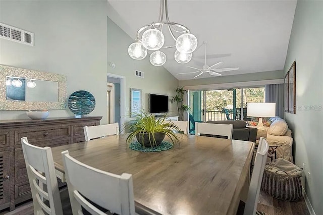 431 Cerromar Ln Unit 446, Venice, FL 34293 - dining space with high vaulted ceiling, a ceiling fan, and a chandelier