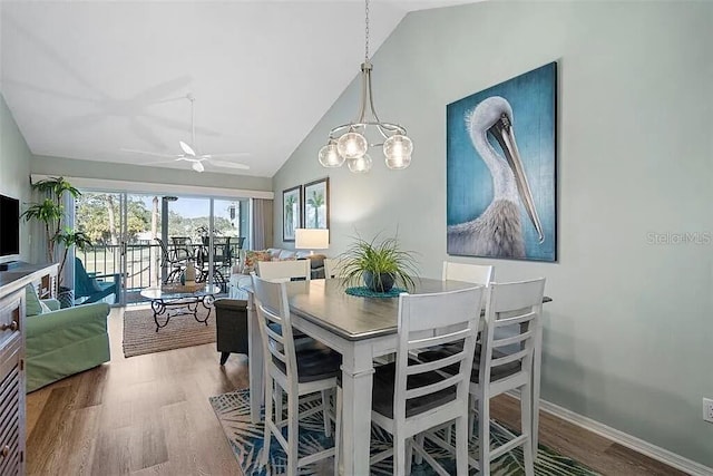 431 Cerromar Ln Unit 446, Venice, FL 34293 - dining space featuring wood finished floors, ceiling fan, high vaulted ceiling, and a chandelier