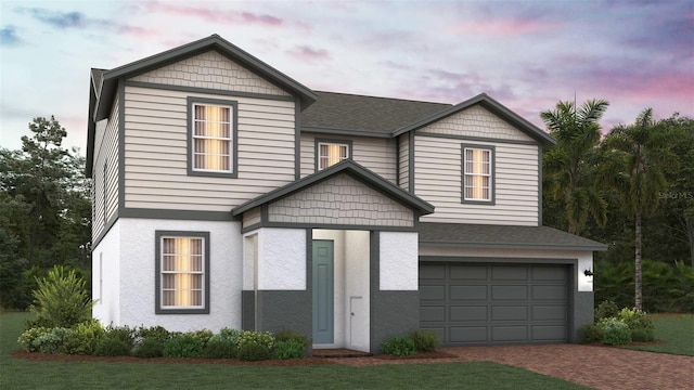 14587 Crestavista Ave, Clermont, FL 34714 - view of front of house featuring a garage, decorative driveway, stucco siding, and a shingled roof