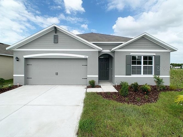 5173 Masser Rd, Saint Cloud, FL 34772 - ranch-style house featuring a garage, driveway, and stucco siding