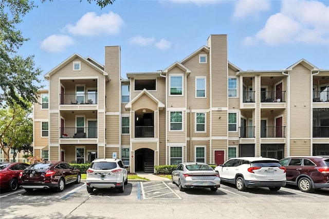2025 Erving Cir Unit 203, Ocoee, FL 34761 - view of property featuring uncovered parking