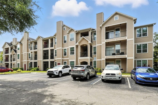 2025 Erving Cir Unit 203, Ocoee, FL 34761 - view of building exterior featuring uncovered parking