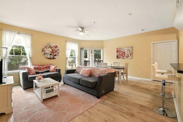 2025 Erving Cir Unit 203, Ocoee, FL 34761 - living area featuring light wood-style flooring and ceiling fan