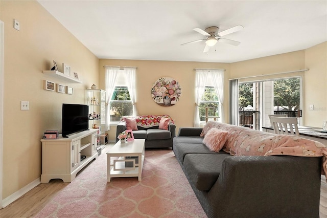 2025 Erving Cir Unit 203, Ocoee, FL 34761 - living area featuring ceiling fan and light wood-style floors