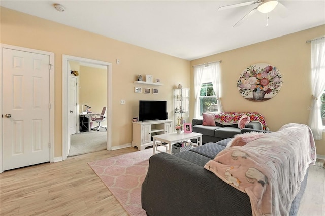 2025 Erving Cir Unit 203, Ocoee, FL 34761 - living room featuring light wood-style flooring and ceiling fan