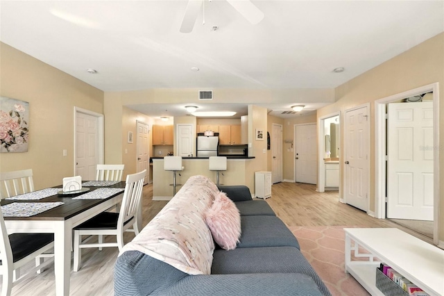 2025 Erving Cir Unit 203, Ocoee, FL 34761 - living room featuring light wood-type flooring and a ceiling fan