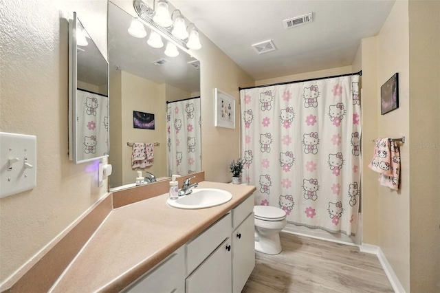 2025 Erving Cir Unit 203, Ocoee, FL 34761 - bathroom with wood finished floors and vanity