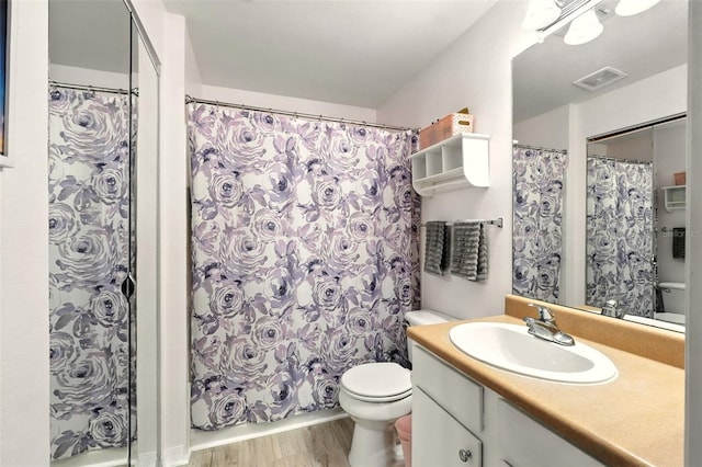 2025 Erving Cir Unit 203, Ocoee, FL 34761 - bathroom featuring vanity, wood finished floors, and a shower with curtain