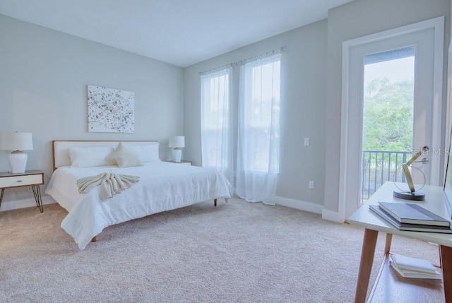 2105 Broome St, Kissimmee, FL 34743 - carpeted bedroom featuring multiple windows and access to outside
